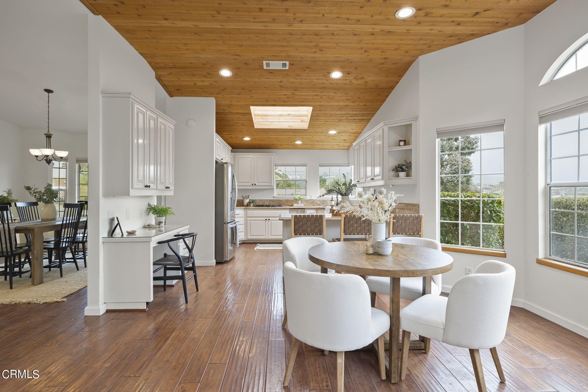 116 Via Pasito Ventura, CA 93003 - Photo 19 of 61 a dining room with furniture a chandelier and wooden floor