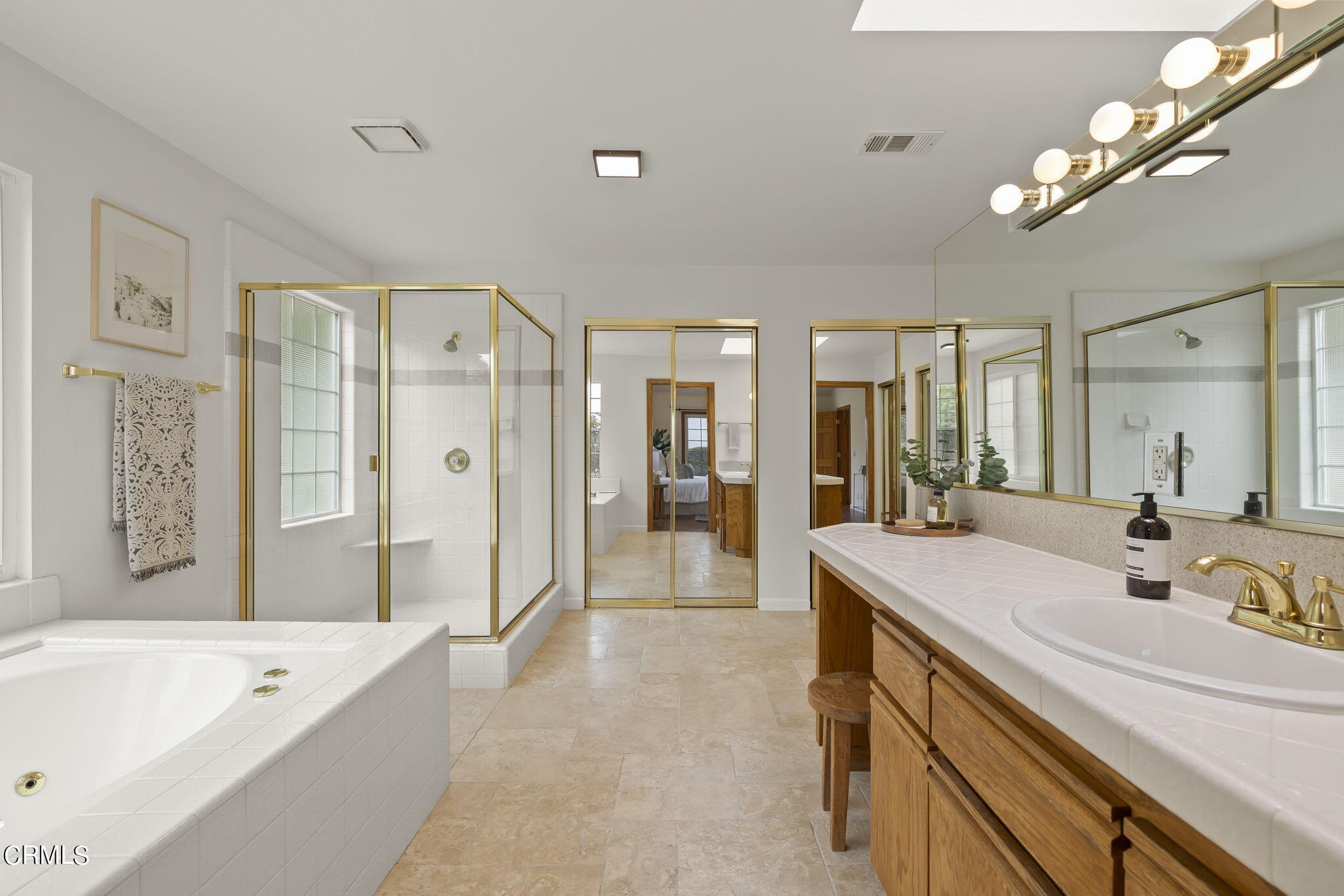 116 Via Pasito Ventura, CA 93003 - Photo 29 of 61 a spacious bathroom with a shower a sink a mirror a bathtub and shower