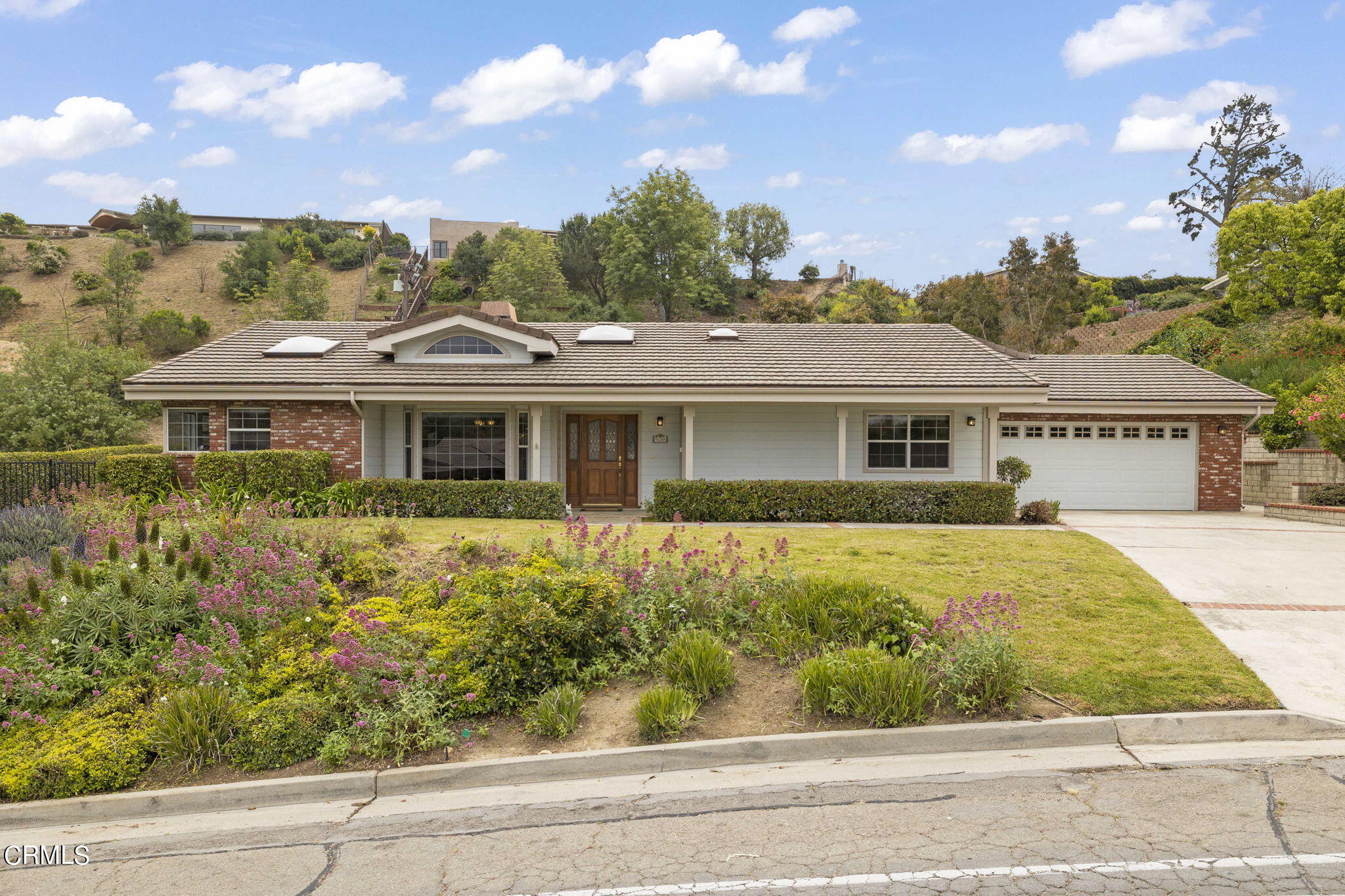 116 Via Pasito Ventura, CA 93003 - Photo 3 of 61 front view of a house with a yard