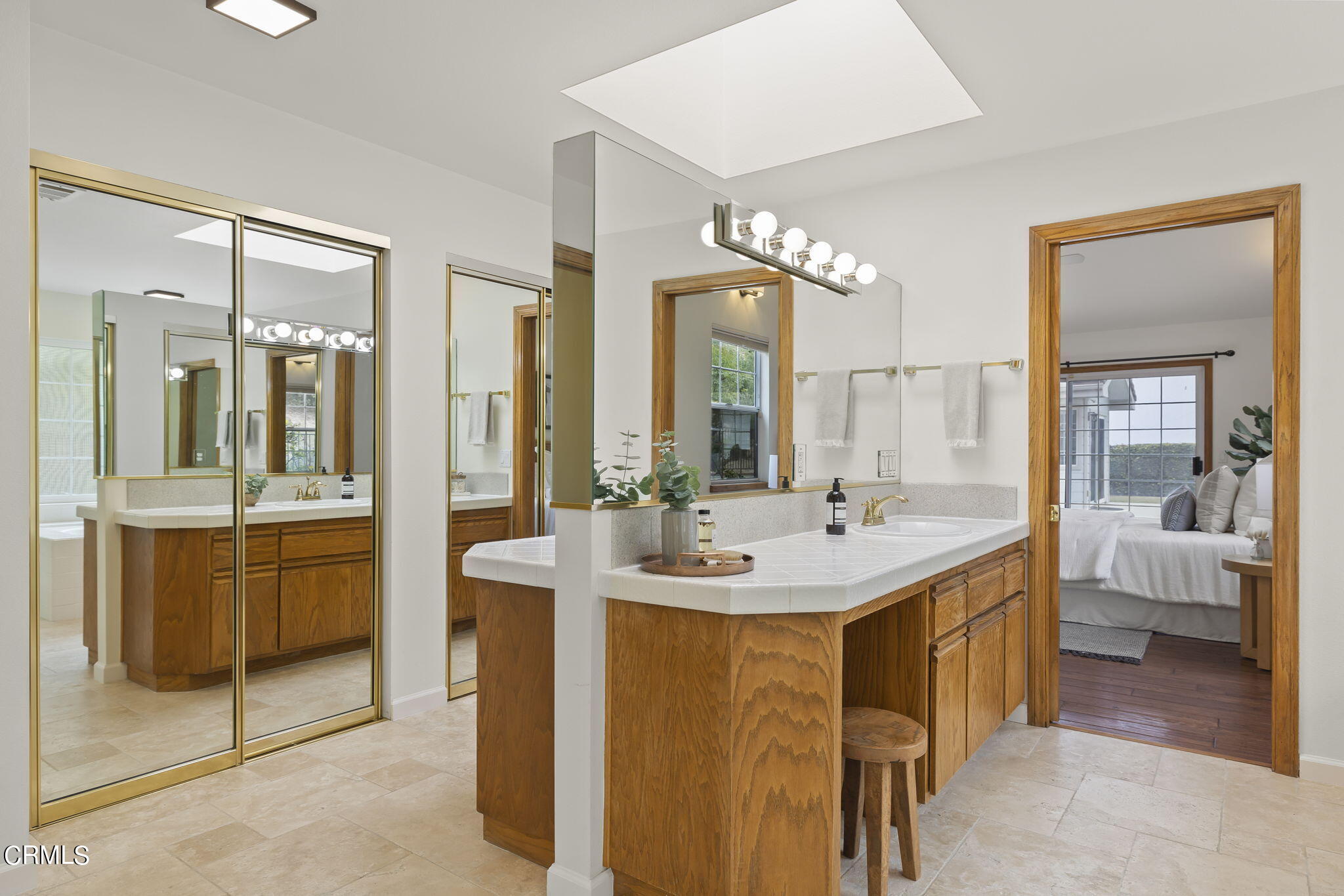 116 Via Pasito Ventura, CA 93003 - Photo 32 of 61 a en suite bathroom with a sink and mirror with bathtub