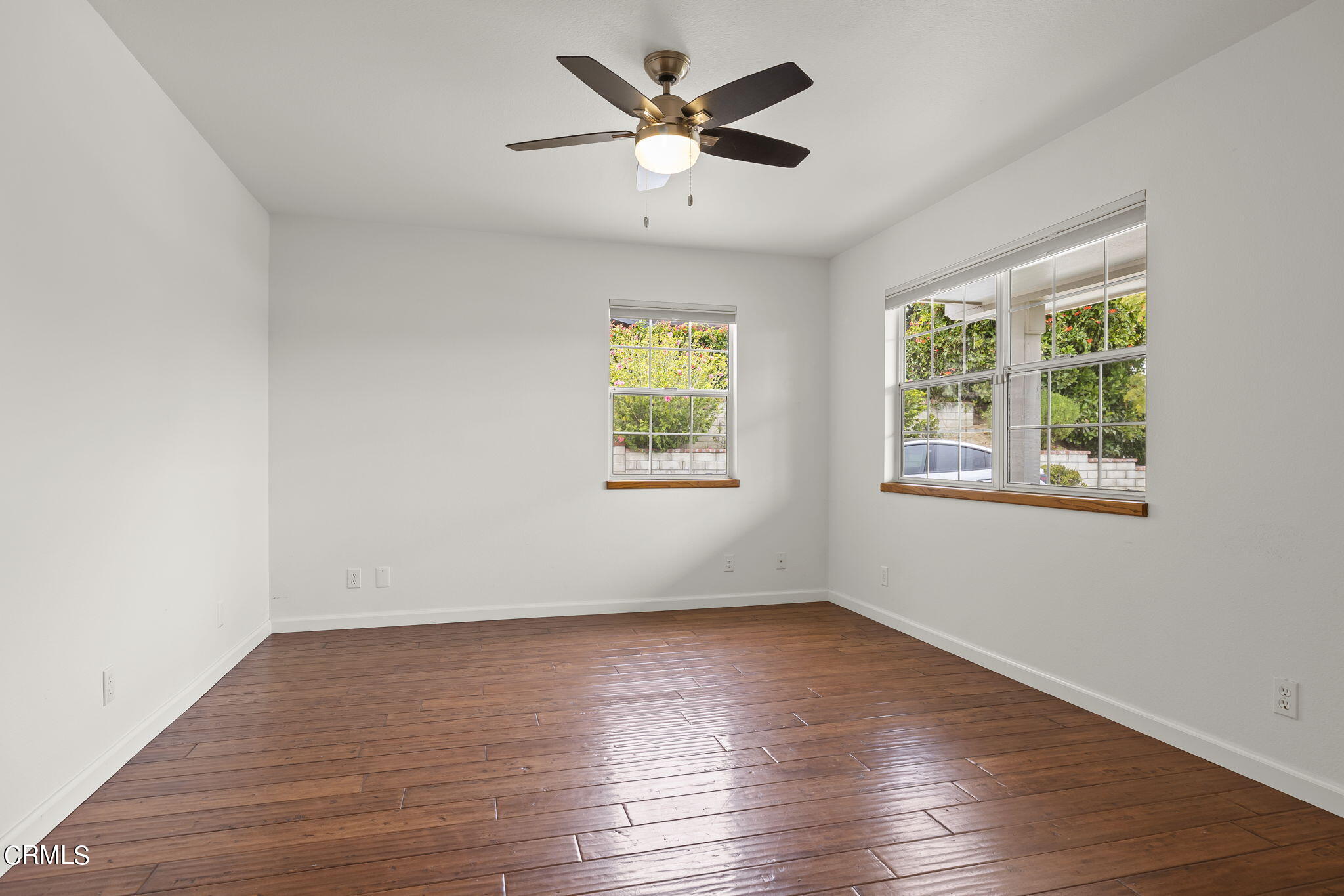 116 Via Pasito Ventura, CA 93003 - Photo 34 of 61 a view of an empty room with window and wooden floor