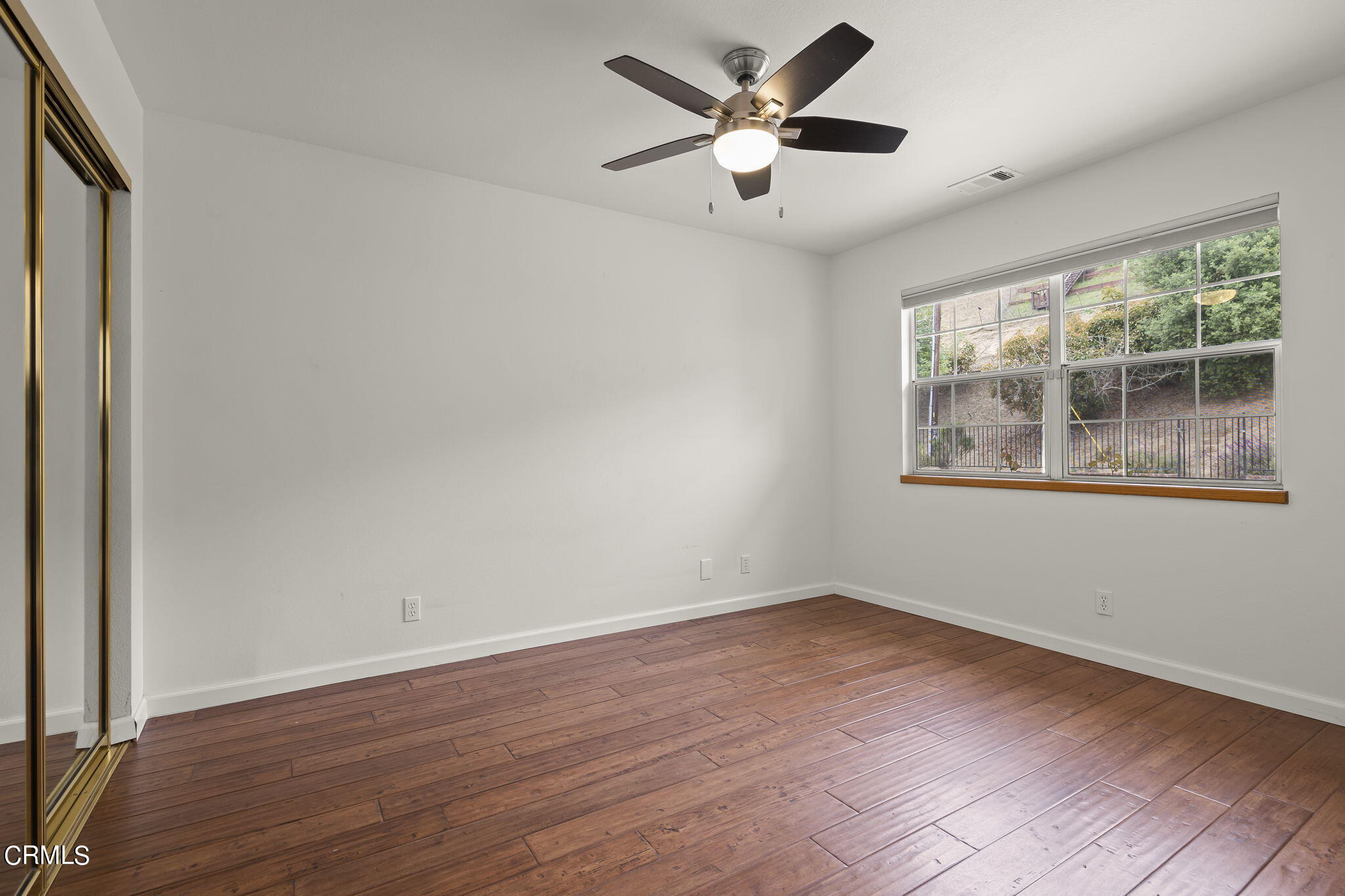 116 Via Pasito Ventura, CA 93003 - Photo 39 of 61 a view of an empty room with wooden floor and a window