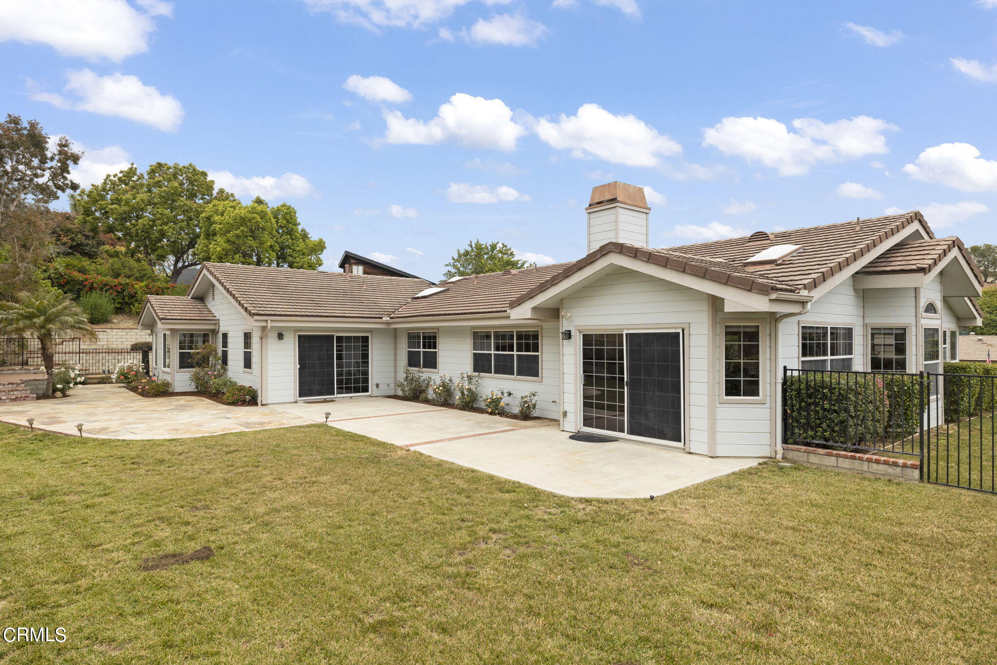 116 Via Pasito Ventura, CA 93003 - Photo 45 of 61 a front view of a house with a garden and yard