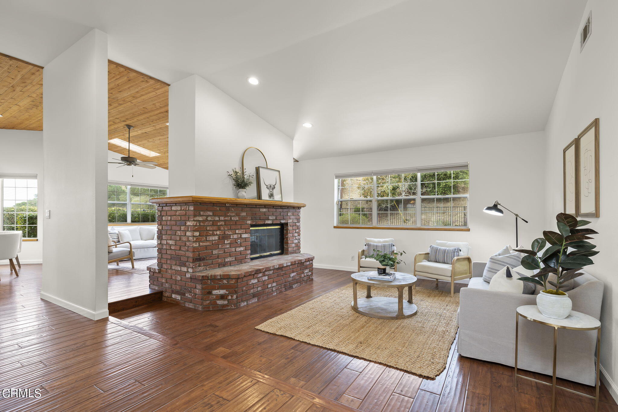 116 Via Pasito Ventura, CA 93003 - Photo 8 of 61 a living room with fireplace furniture and a wooden floor