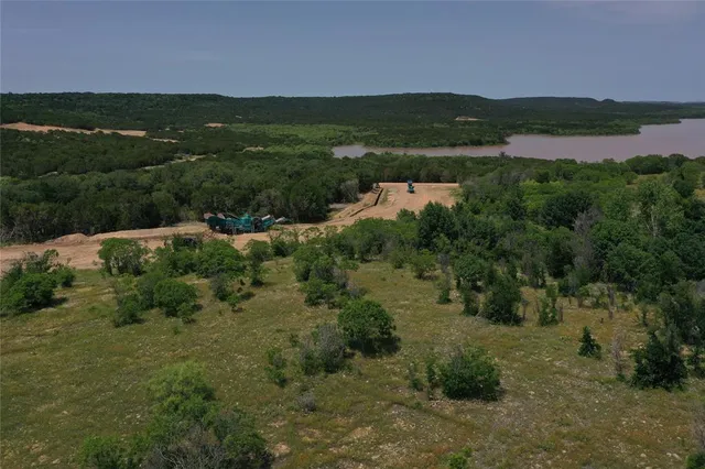 a view of a lake with a yard