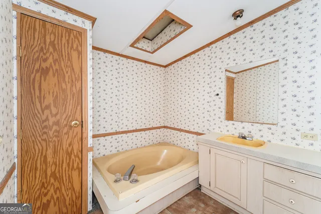 a bathroom with a double vanity sink mirror and toilet