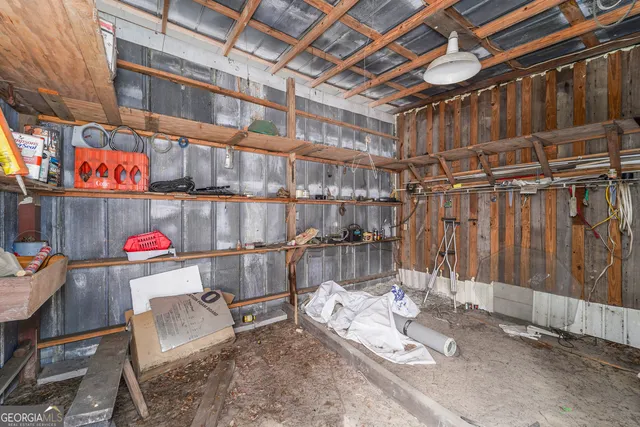 a view of a lush green forest with a houses