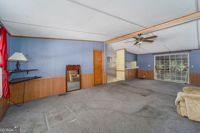 a view of livingroom with furniture and windows