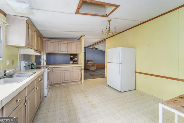 a view of a closet area with an empty room