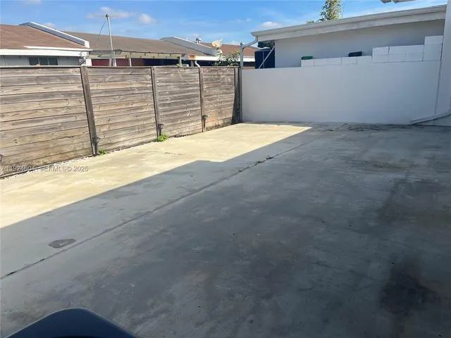 a view of a backyard of the house