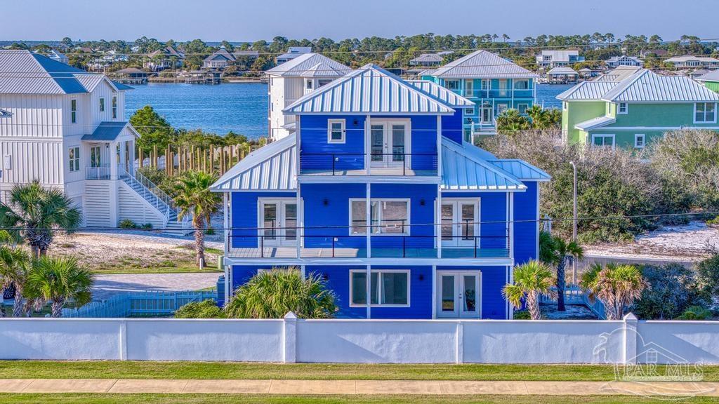 321 Gulfview Lane Perdido Key, FL 32507 - Photo 49 of 57 a view of a house with a swimming pool