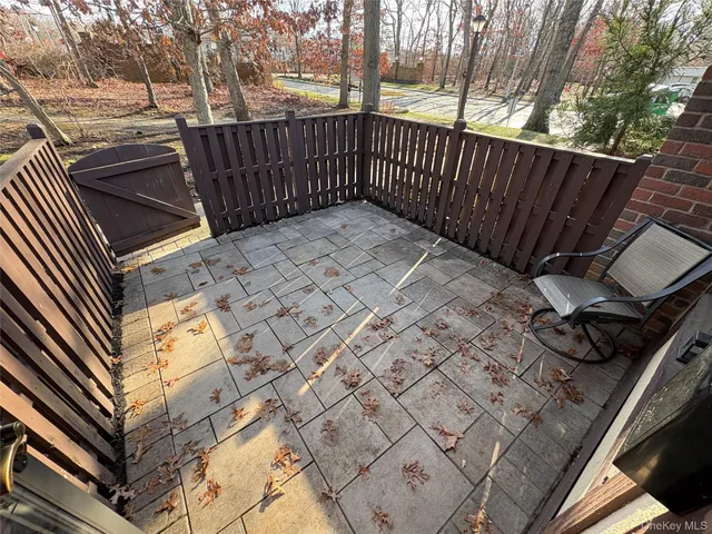a view of a backyard with a wooden fence