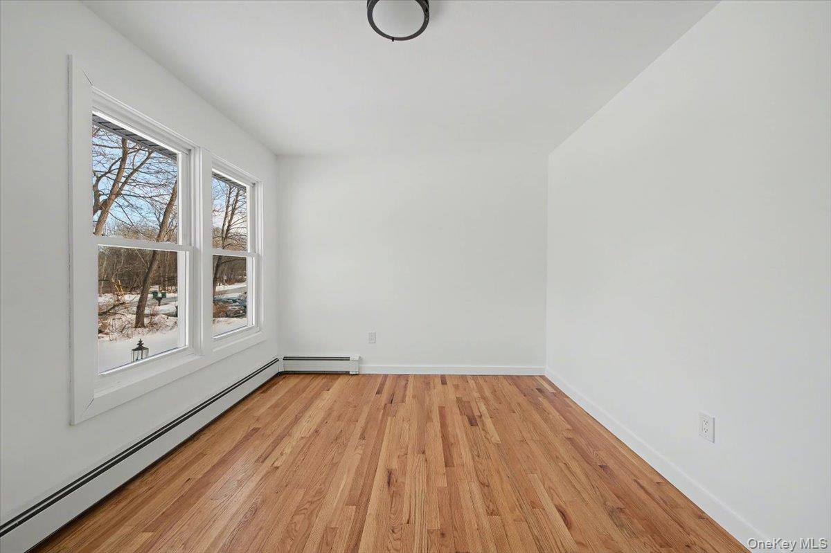 366 Overlook Road Pleasant Valley, NY 12569 - Photo 21 of 39 a view of a room with wooden floor and windows