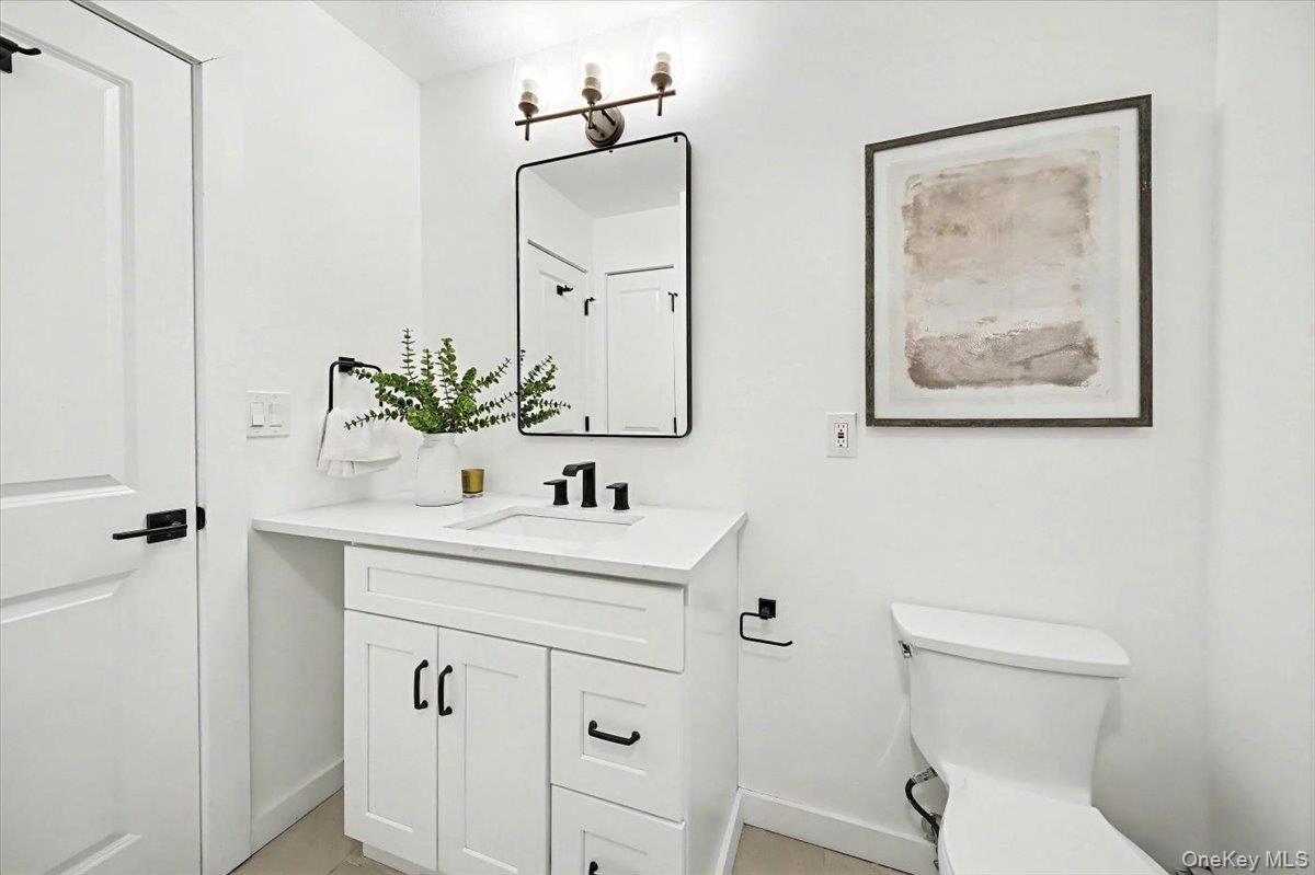 366 Overlook Road Pleasant Valley, NY 12569 - Photo 23 of 39 a bathroom with a toilet a sink and mirror