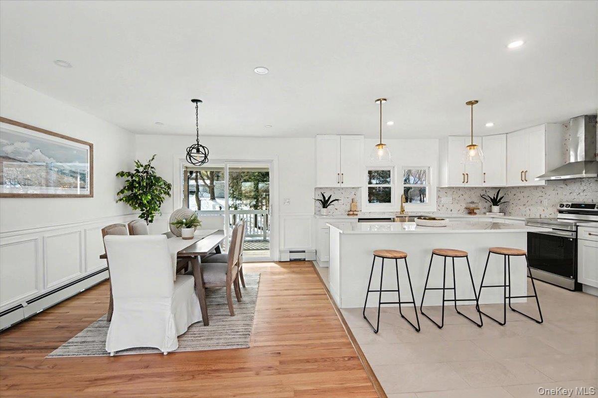366 Overlook Road Pleasant Valley, NY 12569 - Photo 7 of 39 a dining room with stainless steel appliances a dining table chairs and view living room