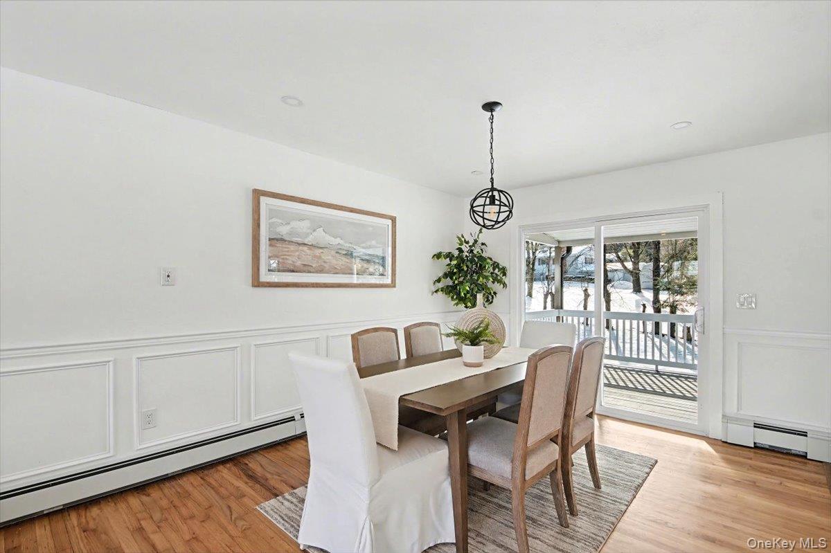 366 Overlook Road Pleasant Valley, NY 12569 - Photo 8 of 39 a dining room with furniture a rug and wooden floor