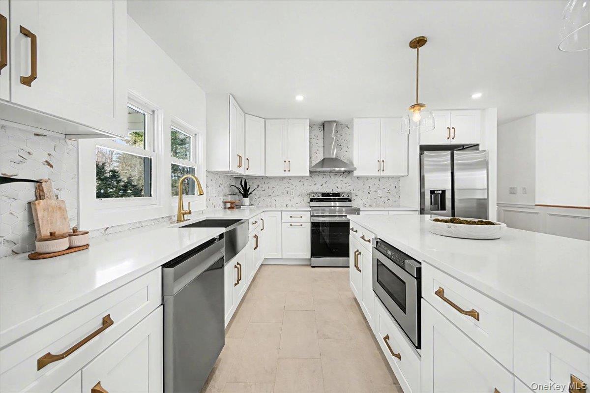 366 Overlook Road Pleasant Valley, NY 12569 - Photo 9 of 39 a kitchen with stainless steel appliances sink stove and cabinets