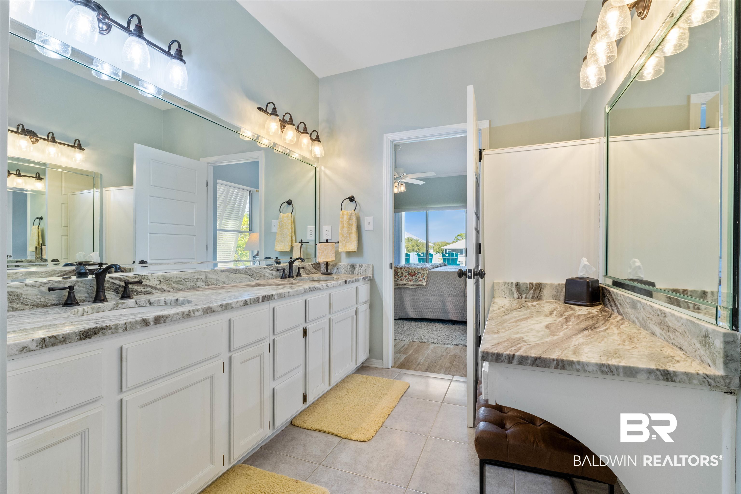 32315 River Road Orange Beach, AL 36561 - Photo 31 of 68 Full bath featuring double vanity, ensuite bath, light tile patterned floors, and ceiling fan