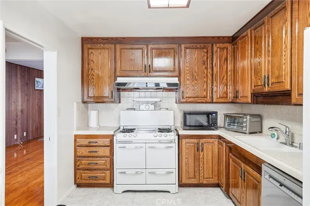 a view of a dining room with furniture and a window