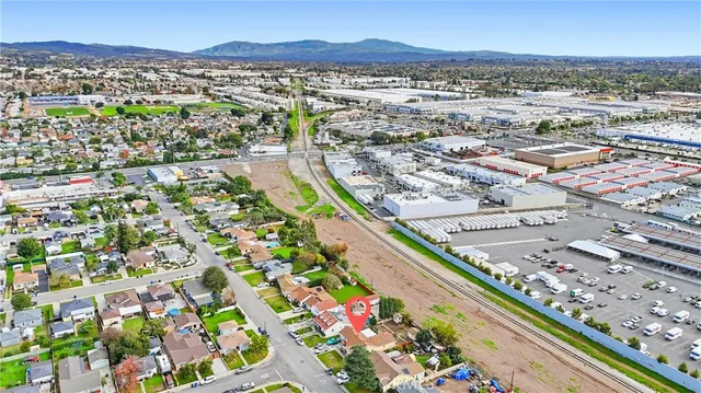an aerial view of residential houses with outdoor space