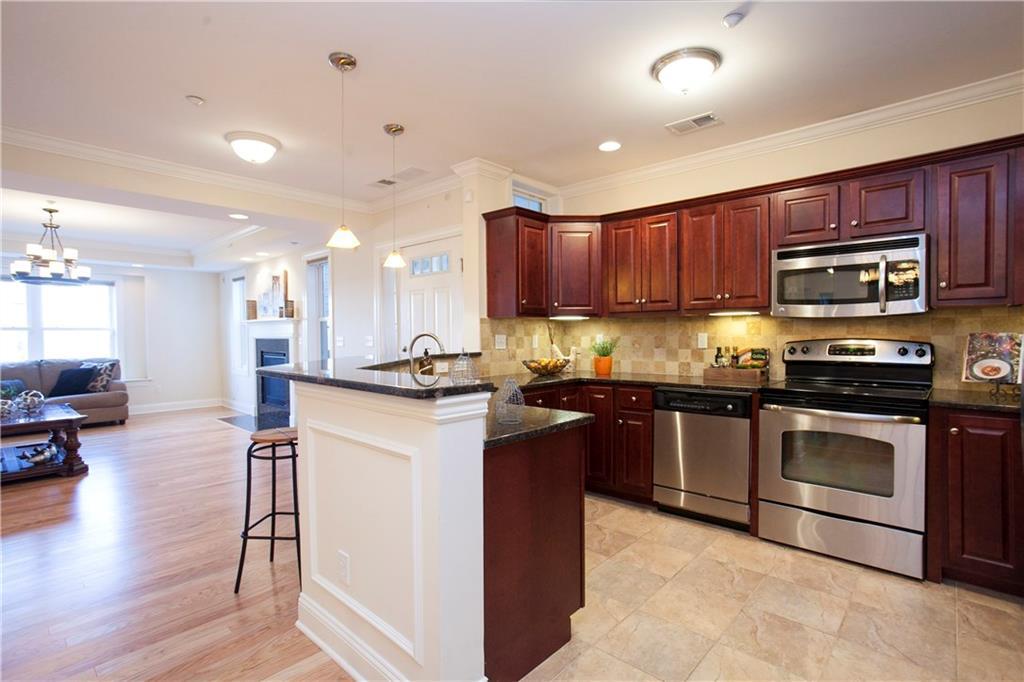 95 South Ridge Lane, Unit DGL2 Berlin, CT 06037 - Photo 1 of 1 a kitchen with stainless steel appliances granite countertop a refrigerator stove top oven and sink