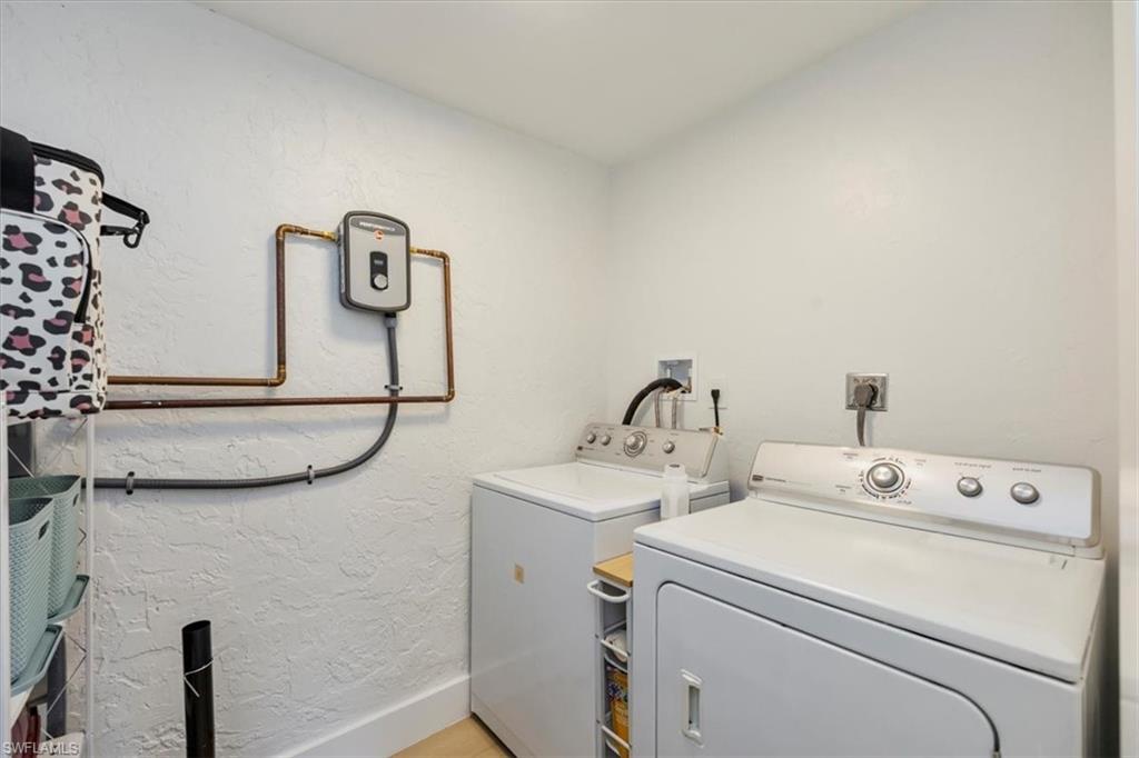 4523 Fluvia Avenue Naples, FL 34103 - Photo 19 of 20 a utility room with dryer and washer