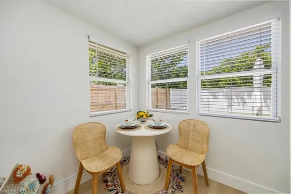 a view of a dining room with furniture window and outside view