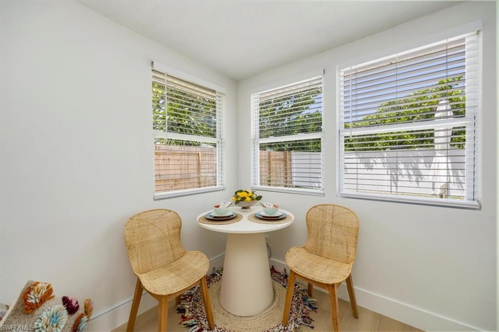 4523 Fluvia Avenue Naples, FL 34103 - Photo 8 of 20 a view of a dining room with furniture window and outside view