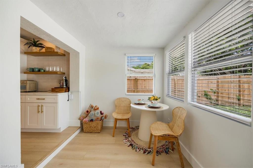 4523 Fluvia Avenue Naples, FL 34103 - Photo 9 of 20 a dining room with furniture and window