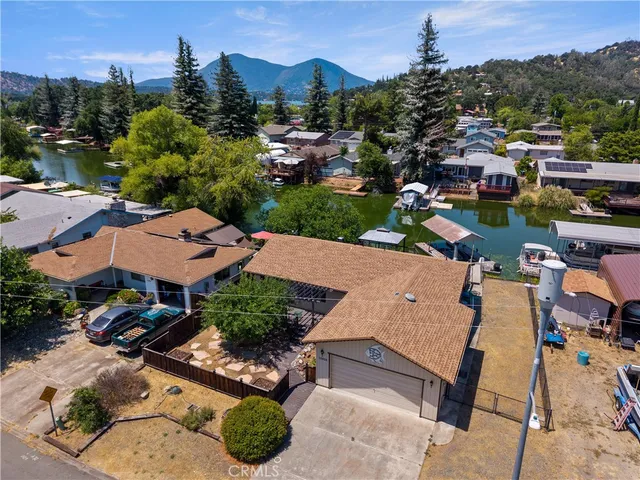 an aerial view of a house with a yard and garden view