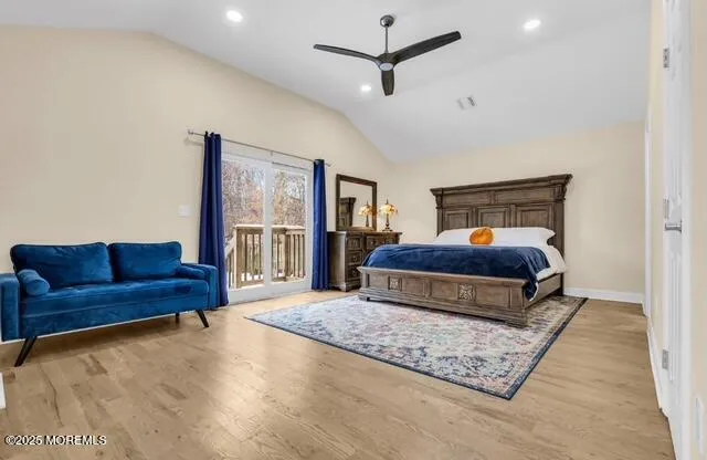 a bedroom with furniture and a rug