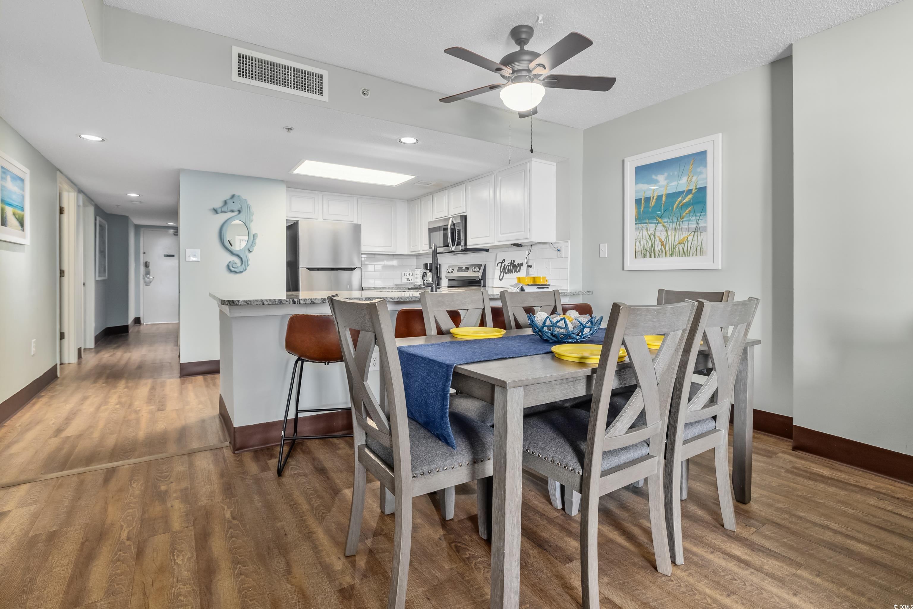 205 74th Avenue North, Unit 1104 Myrtle Beach, SC 29572 - Photo 19 of 40 Dining area featuring dark wood finished floors, a ceiling fan, and recessed lighting