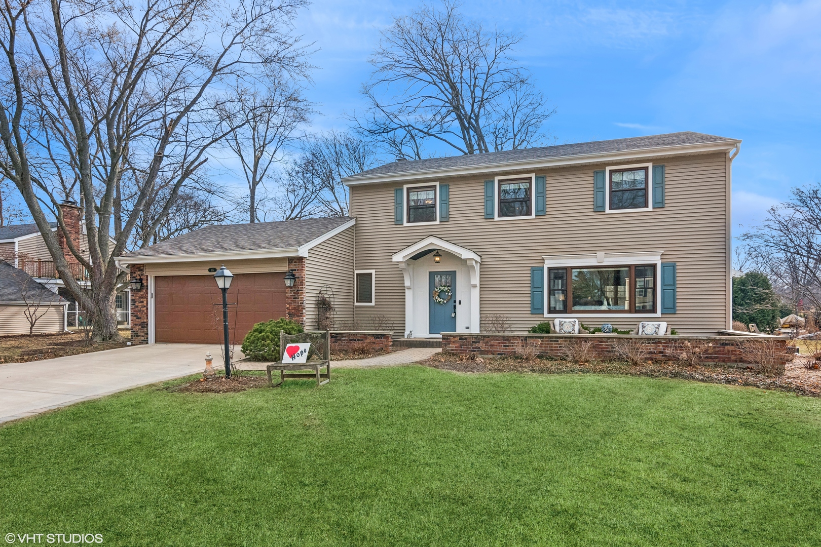 165 Hamilton Lane Wheaton, IL 60189 - Photo 2 of 45 a front view of house with yard and outdoor seating