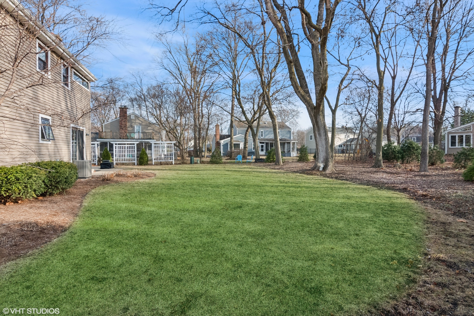 165 Hamilton Lane Wheaton, IL 60189 - Photo 35 of 45 a backyard of apartments with large trees