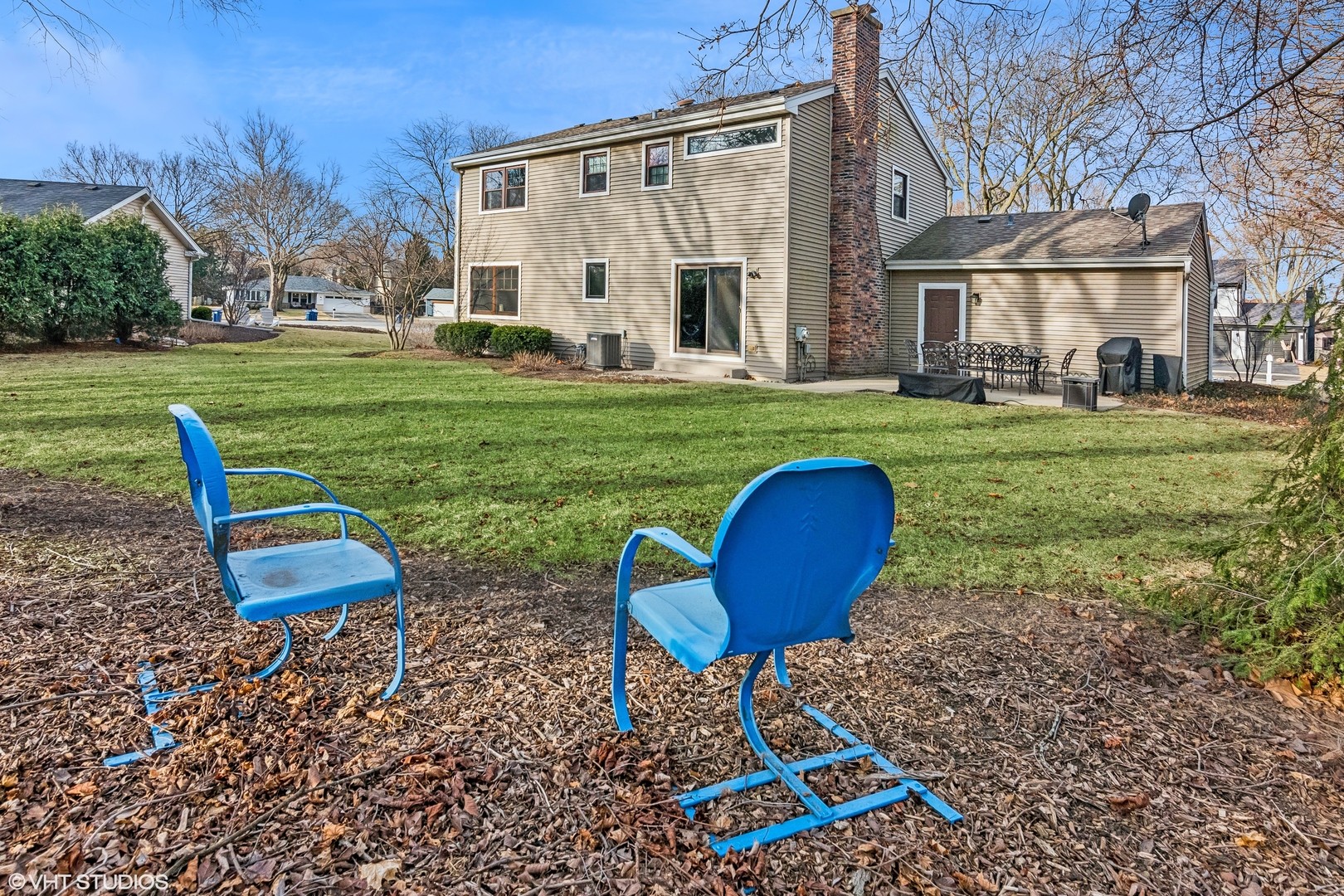 165 Hamilton Lane Wheaton, IL 60189 - Photo 37 of 45 a view of a backyard with table and chairs under an umbrella