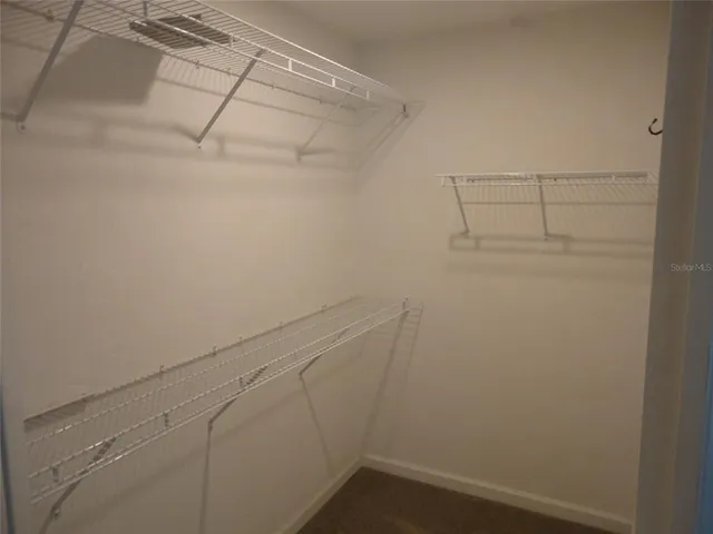 a view of a room with racks on the wall