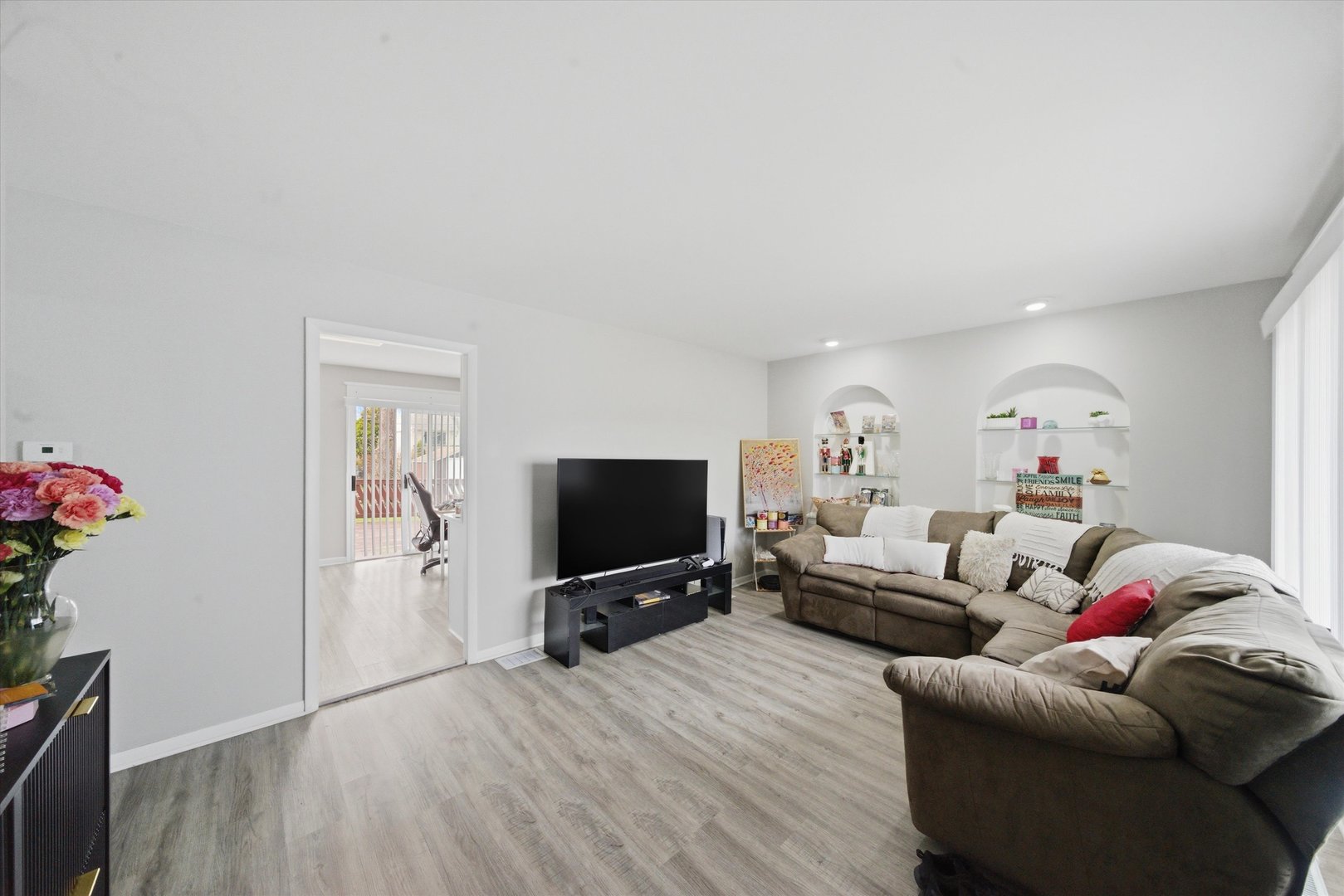 110 Villa Road Streamwood, IL 60107 - Photo 3 of 19 a living room with furniture and a flat screen tv