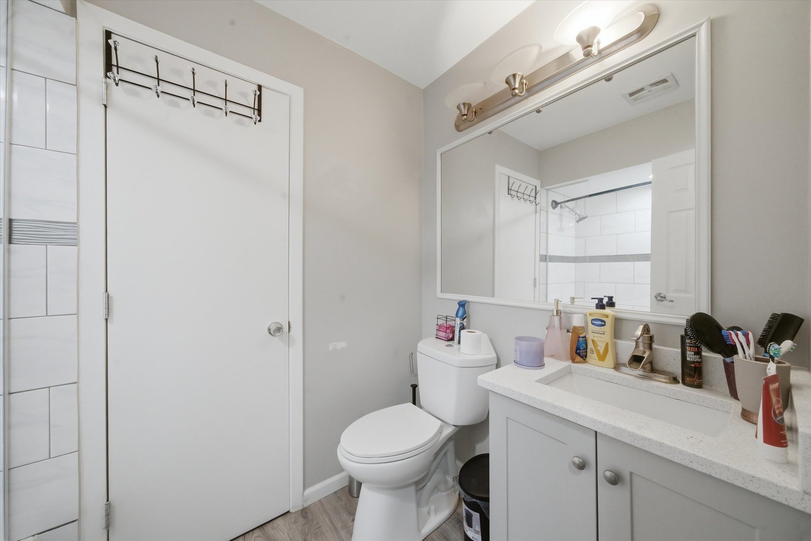 110 Villa Road Streamwood, IL 60107 - Photo 6 of 19 a bathroom with a sink toilet and a mirror