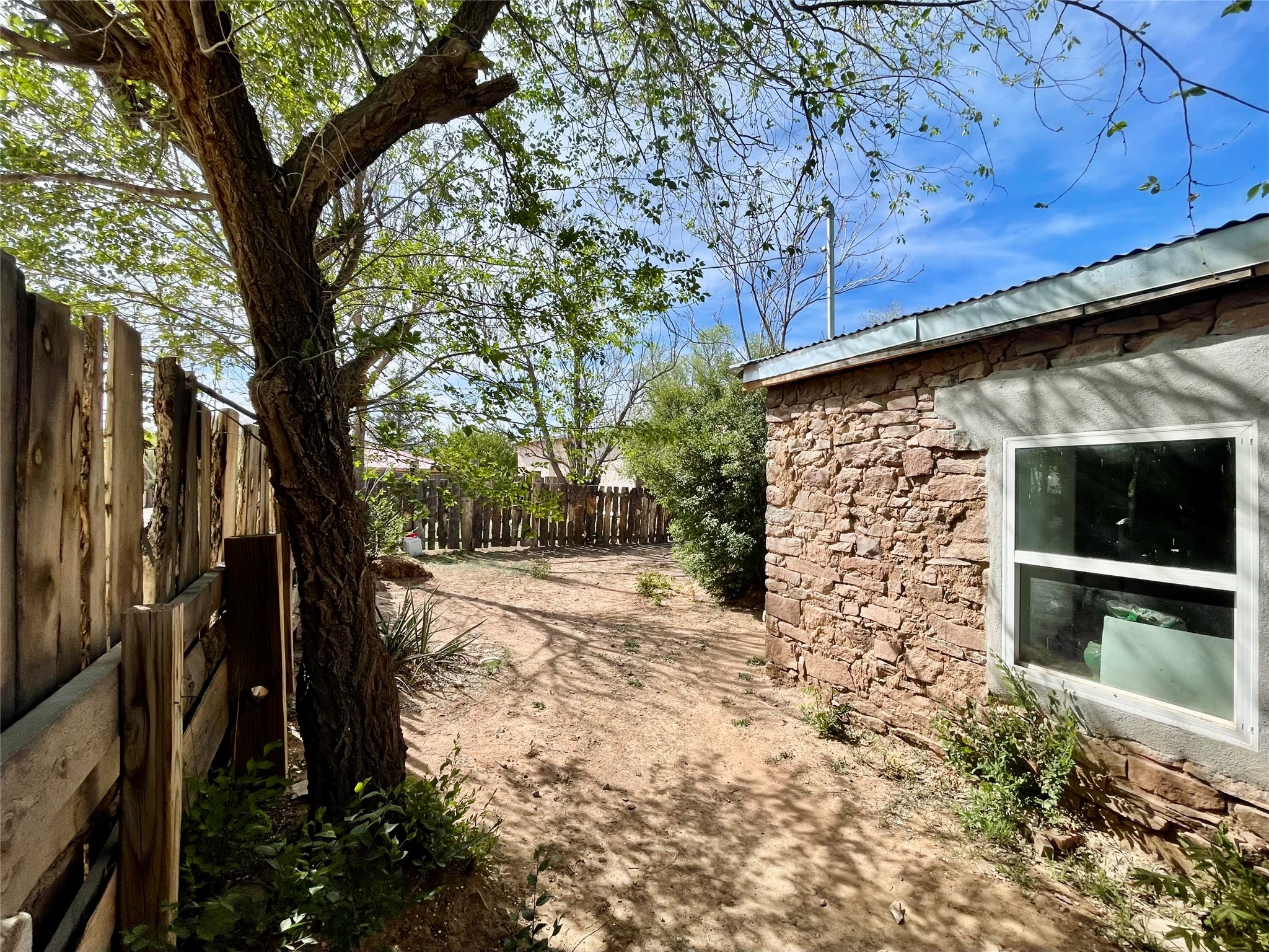 203 Highway 3 Ribera, NM 87560 - Photo 44 of 46 Rock House Side Yard