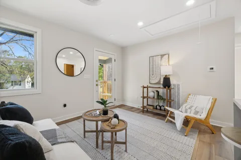 a living room with furniture and a window