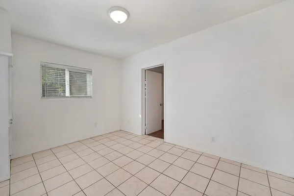 a view of an empty room and window
