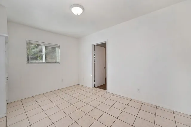 a view of an empty room and window