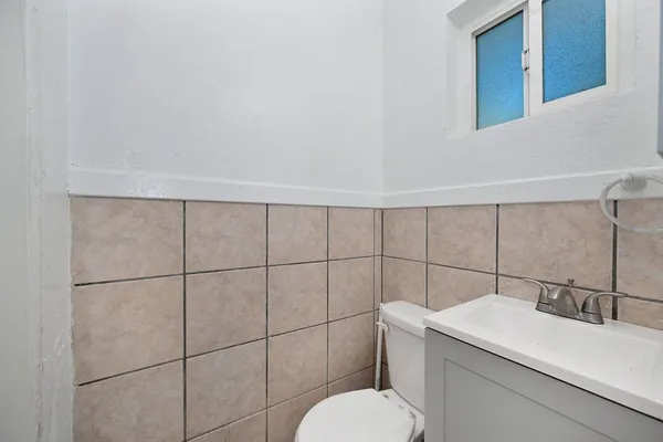 a bathroom with a toilet and a sink