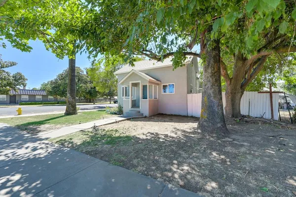 a house with trees in the background