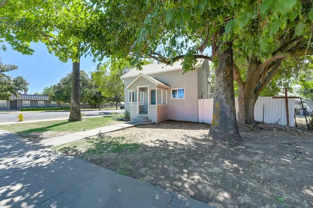 a house with trees in the background