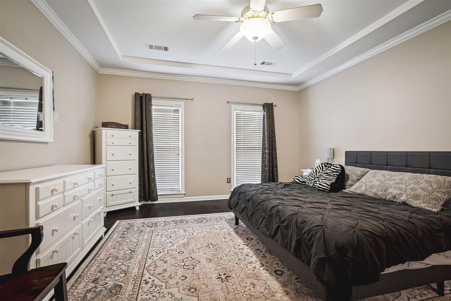 1489 John Ridge Drive Collierville, TN 38017 - Photo 21 of 39 a bedroom with a bed and a chandelier
