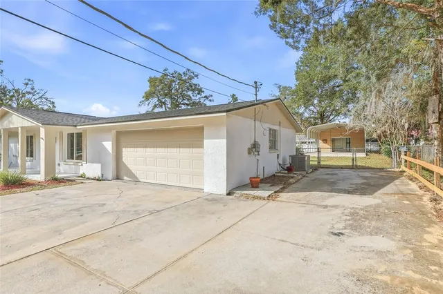 a view of a house with a snow in the yard
