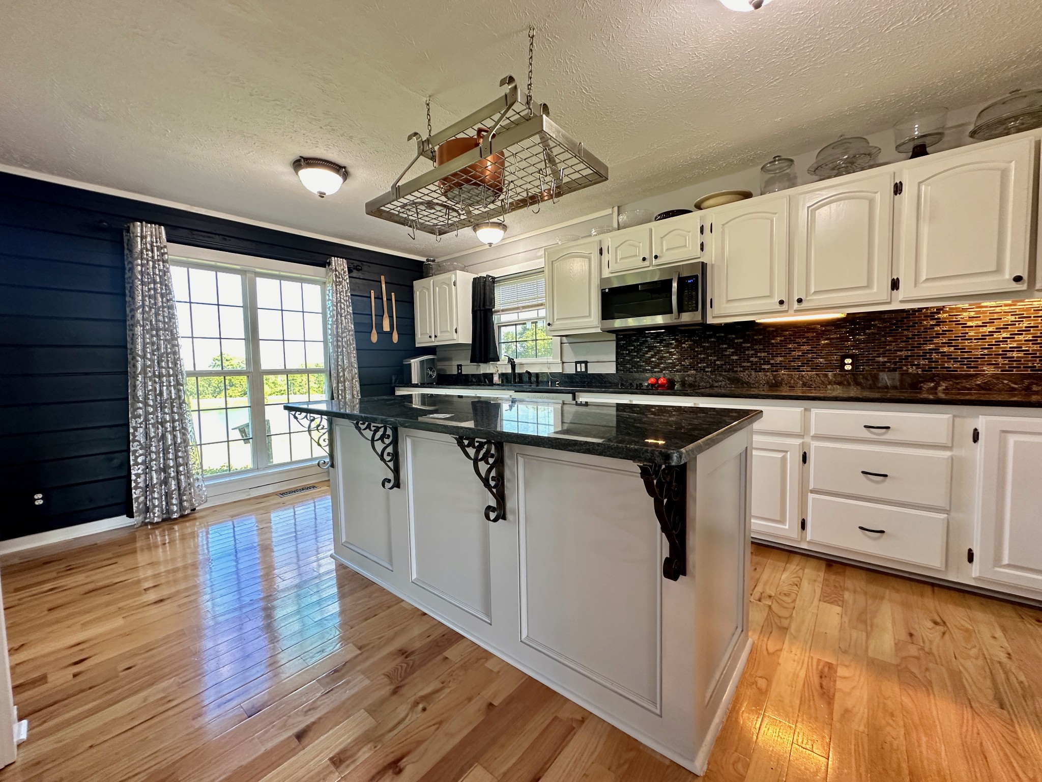 199 Knee Road Watertown, TN 37184 - Photo 16 of 70 a kitchen with granite countertop a sink cabinets stainless steel appliances and window