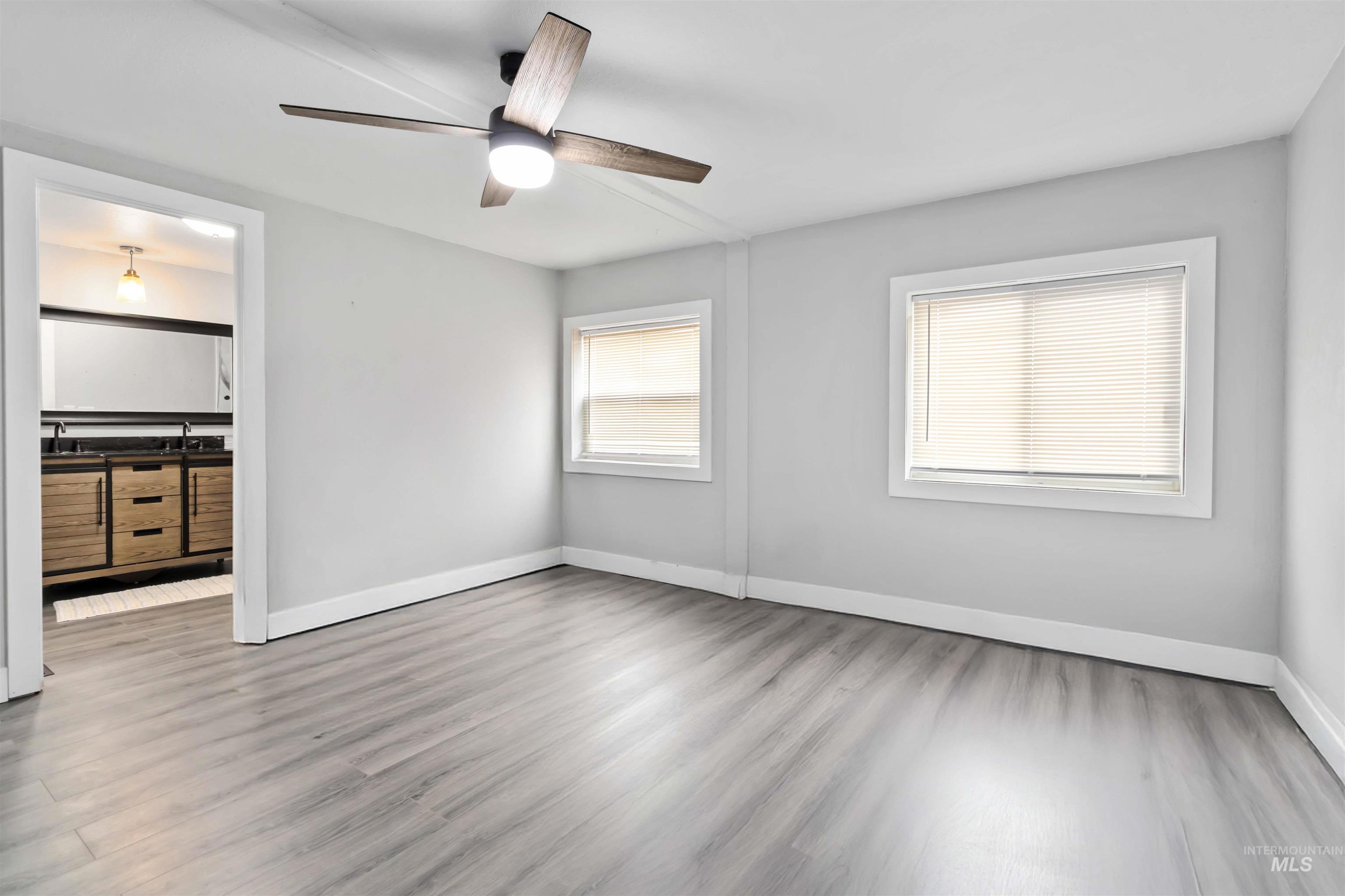 5827 East Little Basin Road King Hill, ID 83633 - Photo 11 of 47 Unfurnished bedroom featuring ceiling fan and light wood-style flooring