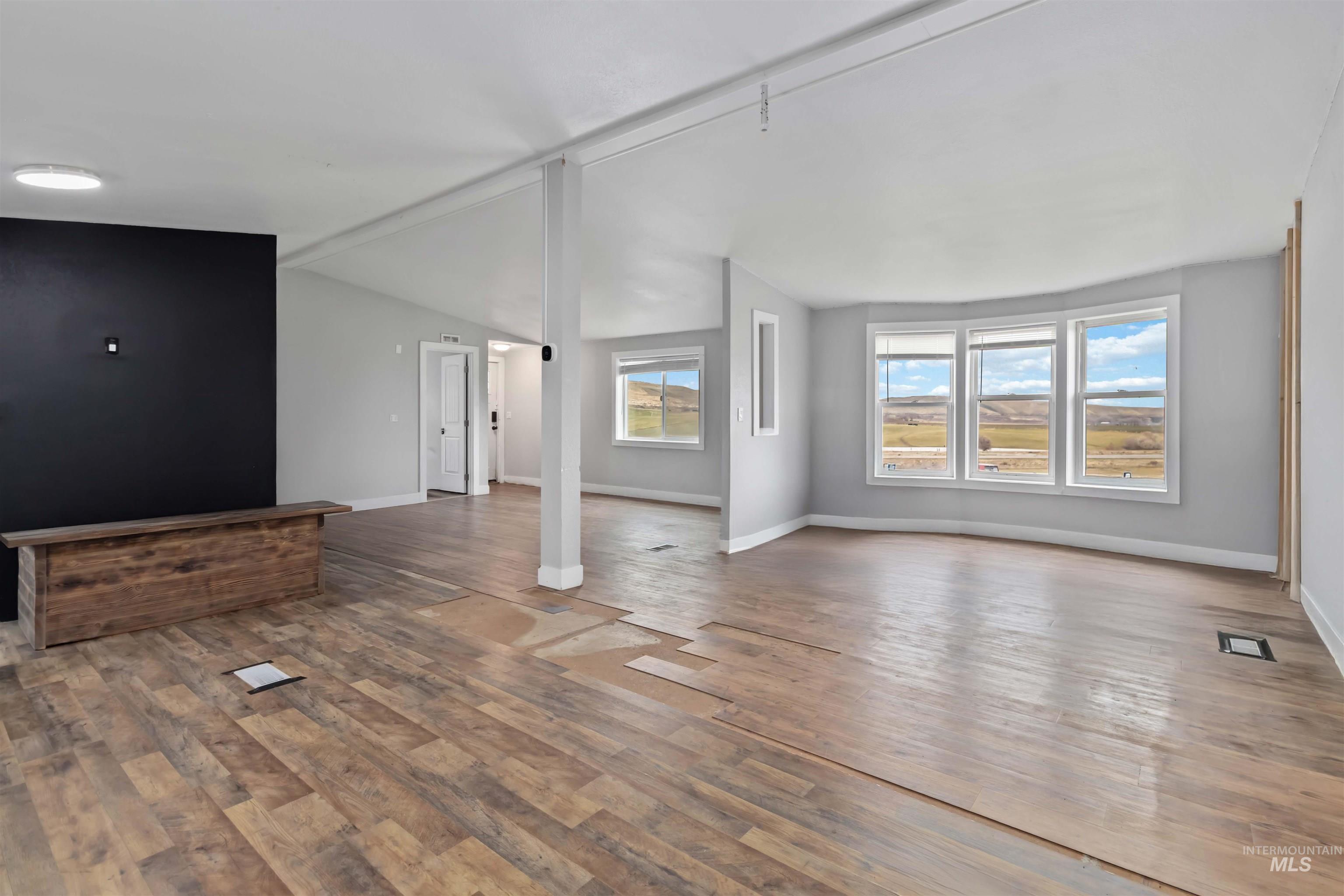 5827 East Little Basin Road King Hill, ID 83633 - Photo 17 of 47 Unfurnished living room featuring lofted ceiling and light wood finished floors